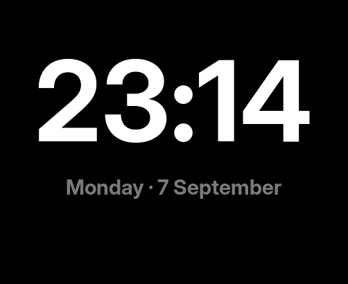 Night mode: 23:14 in large digits with Monday, 7 September underneath