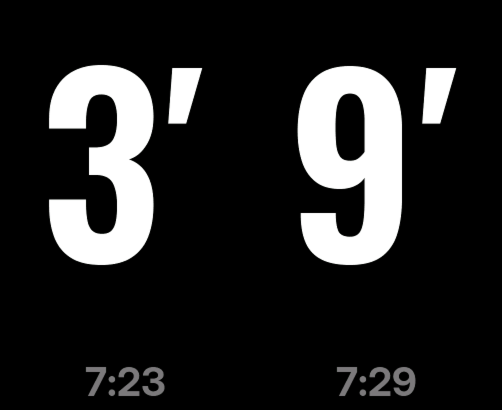 Two large numbers, 3 and 9, with primes, and the departure times 7:23 and 7:29 in grey along the bottom edge